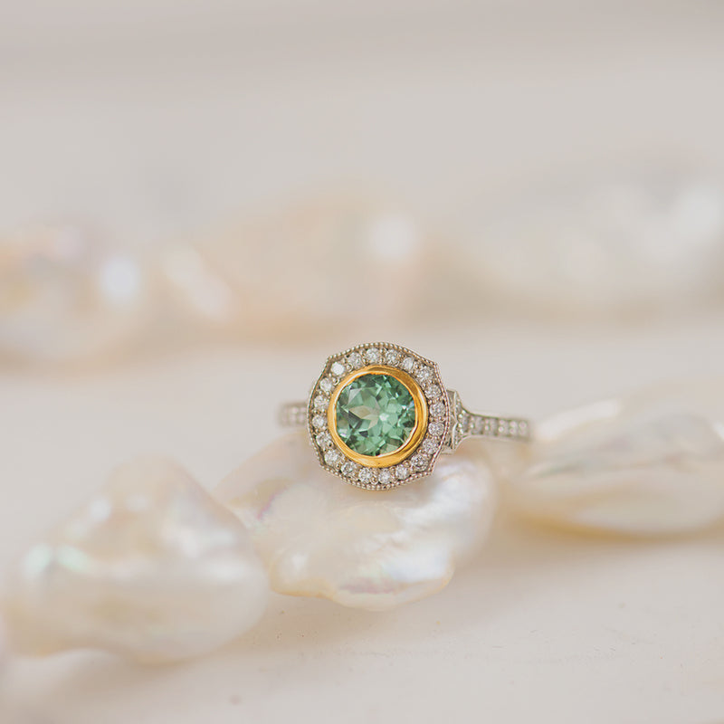 Seafoam Tourmaline 18K White & Yellow Gold ring with a diamond Halo.