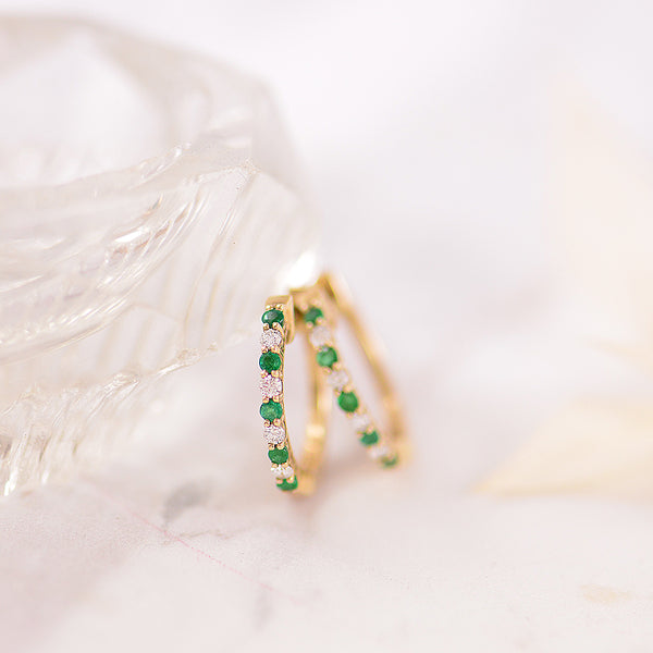 Emerald and Diamond Alternating 9k Yellow Gold Huggy earrings.