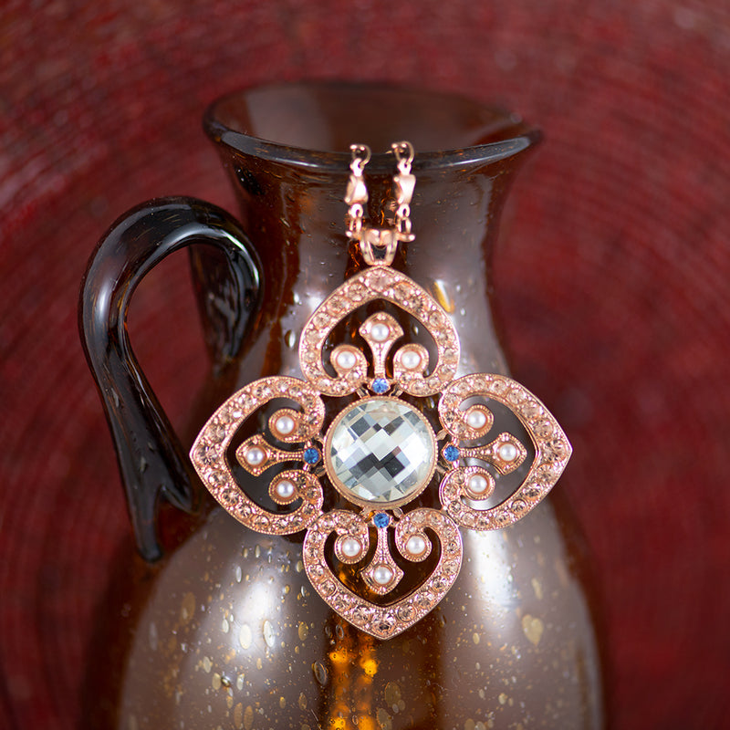 Rose gold plated pendent with blue and clear Austrian crystal with small fresh water pearls