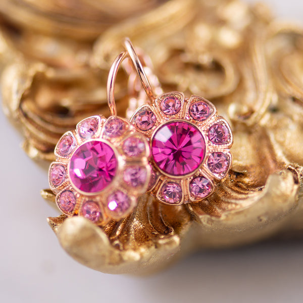 Pink crystal earringsin a daisy style setting with rose gold plating